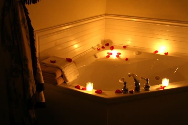 bath tub with rose petals